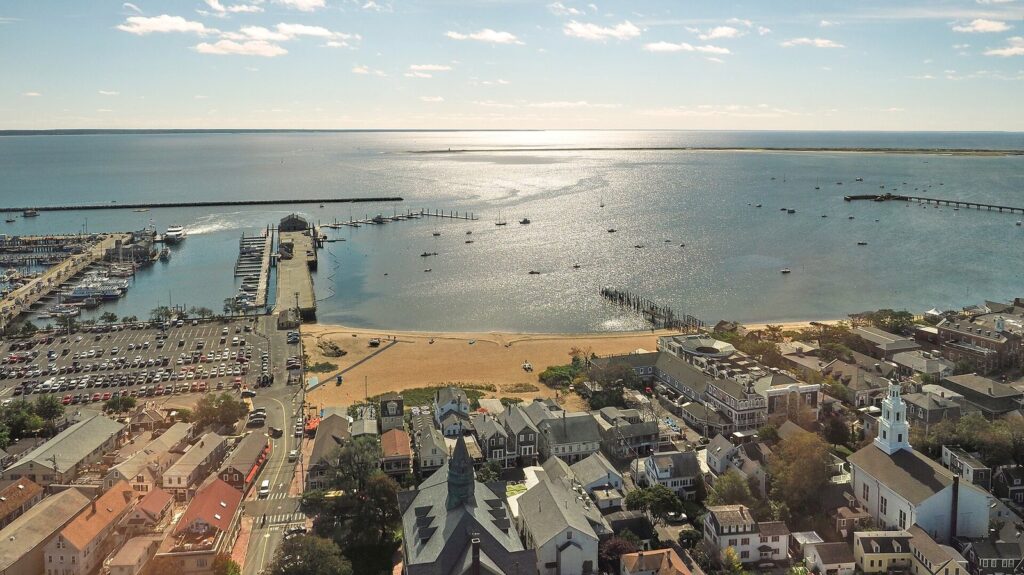 View from the top of the Pilgrim Monument over Provincetown's rooftops to MacMillan Pier and the harbor